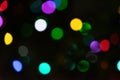 Abstract blur bokeh background. Silver white, red, purple, yellow bokeh light on defocused black background Royalty Free Stock Photo