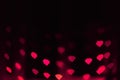 Abstract blur defocused background black, pink lights highlights, bokeh hearts, soft focus