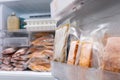 abstract blur and defocused, freezer of modern refrigerator full of frozen food products