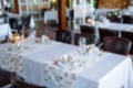 Abstract blur and defocused table setting in restaurant for background Royalty Free Stock Photo