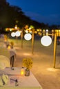 Abstract blur image of Outdoor Cafe or restaurant in night time with bokeh for background usage Royalty Free Stock Photo