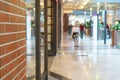 Abstract blur luxury shopping mall and retails store interior with brick wall for background