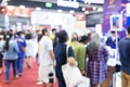 Abstract blur people in exhibition hall event trade show expo background. Business convention show, job fair, or stock market. Royalty Free Stock Photo