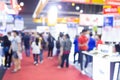 Abstract blur people in exhibition hall event trade show expo background. Business convention show, job fair, or stock market. Royalty Free Stock Photo