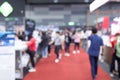 Abstract blur people in exhibition hall event trade show expo background. Business convention show, job fair, or stock market. Royalty Free Stock Photo