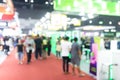 Abstract blur people in exhibition hall event trade show expo background. Business convention show, job fair, or stock market. Royalty Free Stock Photo