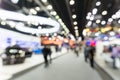 Abstract blur people in exhibition hall event trade show expo background. Large international exhibition, convention center Royalty Free Stock Photo