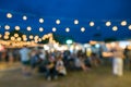 Abstract blur people in night festival city park bokeh background - vintage outdoor Royalty Free Stock Photo