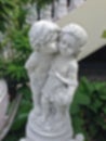 Abstract blur statue of a young boy kissing a girl on the cheek. Royalty Free Stock Photo
