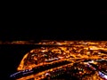 Abstract Blurred background Aerial night view of a big city. Cityscape panorama bokeh at night. Blurry Aerial view of skyscraper a Royalty Free Stock Photo