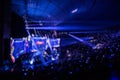 Abstract blurred background of big esports gaming event at big arena. Royalty Free Stock Photo