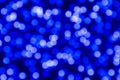 Abstract blurred background with blu light confetti circles with bokeh effect on a dark background with blue shadows Royalty Free Stock Photo