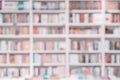 Abstract blurred background of bookshelves with books in library, book store. Concept of learning, school, education Royalty Free Stock Photo