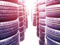 Abstract blurred background with car tires for sale. Blur photo of lots of car tires in the shop for sale. Car parts store bokeh b Royalty Free Stock Photo