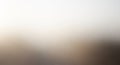 Abstract blurred background with a gradient of soft beige and gray tones. No distinct Royalty Free Stock Photo