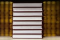 Abstract blurred background of Heap of closed books in hard covers on dark background. Education, school, study, reading
