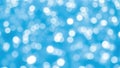 Abstract blurred background of light blue water with bokeh circles and bright reflections on the surface Royalty Free Stock Photo