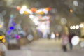 Abstract blurred background. People walking on street decorated Christmas trees Royalty Free Stock Photo