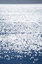 Abstract blurred background.Spots white reflections of shining sun blue surface