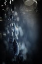 Abstract blurred black and blue background. Blurred raindrops with bokeh. Drops of rain water on a black waterproof fabric Royalty Free Stock Photo