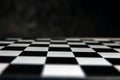 Abstract blurred black and white chess board game competition on dark background Royalty Free Stock Photo