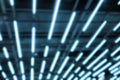 Abstract blurred blue neon led light lamp stripes on mall ceiling or roof. Perspective striped futuristic loft modern background Royalty Free Stock Photo