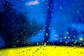 Abstract blurred blue and yellow background with drops Royalty Free Stock Photo