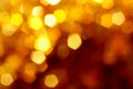 Abstract blurred bokeh background, yellow, gold, orange, festive, Christmas, party Royalty Free Stock Photo