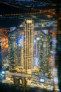 Abstract blurred bokeh boke background of illuminated cityscape with skyscrapers in Dubai. Moving through modern city