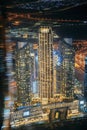 Abstract blurred bokeh boke background of illuminated cityscape with skyscrapers in Dubai. Moving through modern city