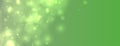 abstract blurred bokeh green banner with shiny particle Royalty Free Stock Photo