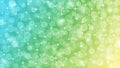 Abstract Blurred Bokeh, Sparkles and Bubbles in Pastel Blue, Green and Yellow Background Royalty Free Stock Photo