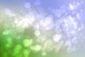 Abstract blurred bright spring or summer landscape texture with natural light green white bokeh lights and blue bright sunny sky Royalty Free Stock Photo
