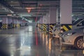 Abstract blurred car parking, garage, interior of underground parking with cars in building of shopping mall. Defocused Royalty Free Stock Photo