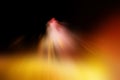 Abstract blurred colored dark background, radial rays of orange, pink, black and light yellow spots Royalty Free Stock Photo