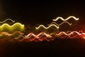 Abstract blurred colorful light effect on a black background. Long exposure photo of moving camera Royalty Free Stock Photo