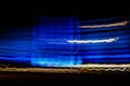 Abstract blurred colorful light effect on a black background. Long exposure photo of moving camera Royalty Free Stock Photo