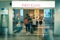 Abstract blurred customers enter a first class lounge at modern Asian airport