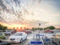 Blurry background parking garage with return shopping carts under sunset cloud near Dallas Royalty Free Stock Photo