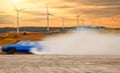 Abstract blurred drift car with smoke from burned tire at wind t Royalty Free Stock Photo