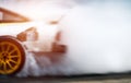 Abstract blurred drift cars with smoke from burned tire