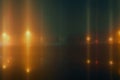 An abstract blurred edit of glowing city street lights reflected in water. On a mysterious foggy winters night Royalty Free Stock Photo