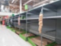 Abstract blurred empty retail shop shelves in supermarket. Royalty Free Stock Photo