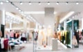 Abstract blurred of fashion clothes shop boutique interior in shopping mall, with bokeh light background. Blurred image of Royalty Free Stock Photo