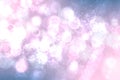 Abstract blurred festive light blue pink winter christmas or Happy New Year background with shiny blue and white bokeh lighted Royalty Free Stock Photo