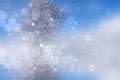 Abstract blurred festive light blue winter christmas or Happy New Year background with shiny blue and white bokeh lighted Royalty Free Stock Photo