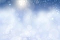Abstract blurred festive light blue winter christmas or Happy New Year background texture with shiny blue and white bokeh lighted Royalty Free Stock Photo