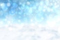 Abstract blurred festive winter christmas background with shiny blue and yellow white bokeh lighted snow landscape with stars and Royalty Free Stock Photo