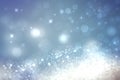 Abstract blurred festive winter christmas or Happy New Year background with shiny blue and white bokeh lighted snow landscape. Royalty Free Stock Photo