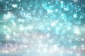 Abstract blurred festive winter christmas or Happy New Year background with shiny blue and white bokeh lighted snow landscape with Royalty Free Stock Photo